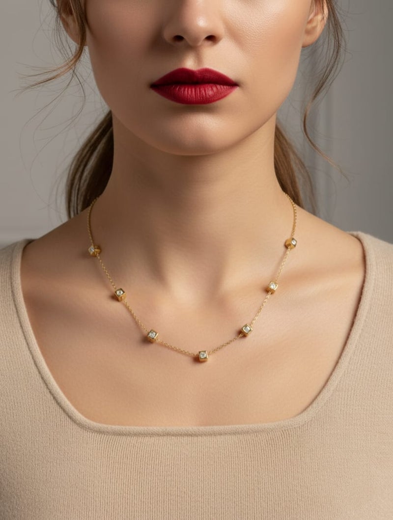 A delicate gold necklace studded with regularly distributed, shiny square stones, made of rust-resistant stainless steel with an adjustable clasp. - Image 3
