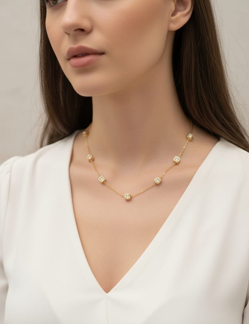 A delicate gold necklace studded with regularly distributed, shiny square stones, made of rust-resistant stainless steel with an adjustable clasp. - Image 2