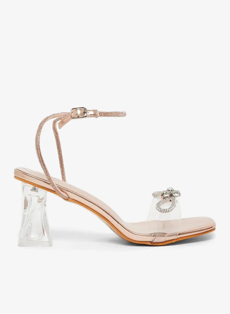 تايك تو صنادل بكعب شفاف مزينة من ستايلي