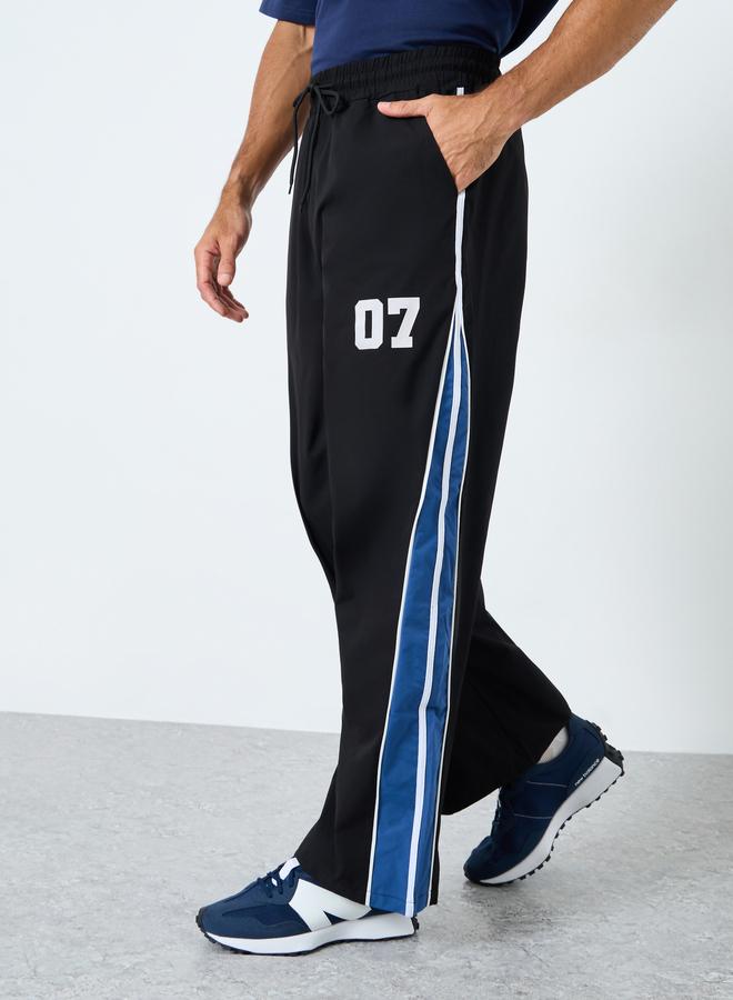 Styli Oversized Fit Cut and Sew Detail Parachute Pant - Image 1