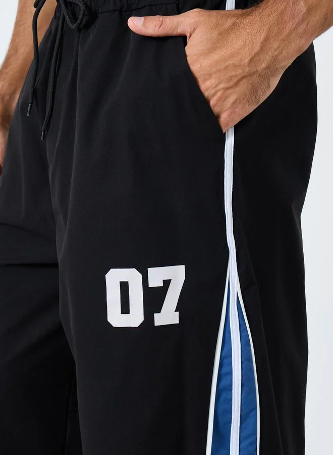 Styli Oversized Fit Cut and Sew Detail Parachute Pant