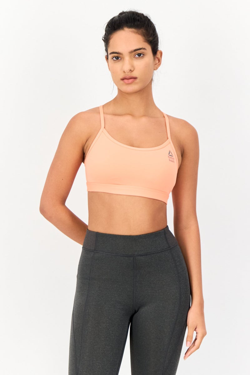 Reebok حمالة صدر رياضية مبطنة بشعار العلامة التجارية للنساء، خوخي - Image 1