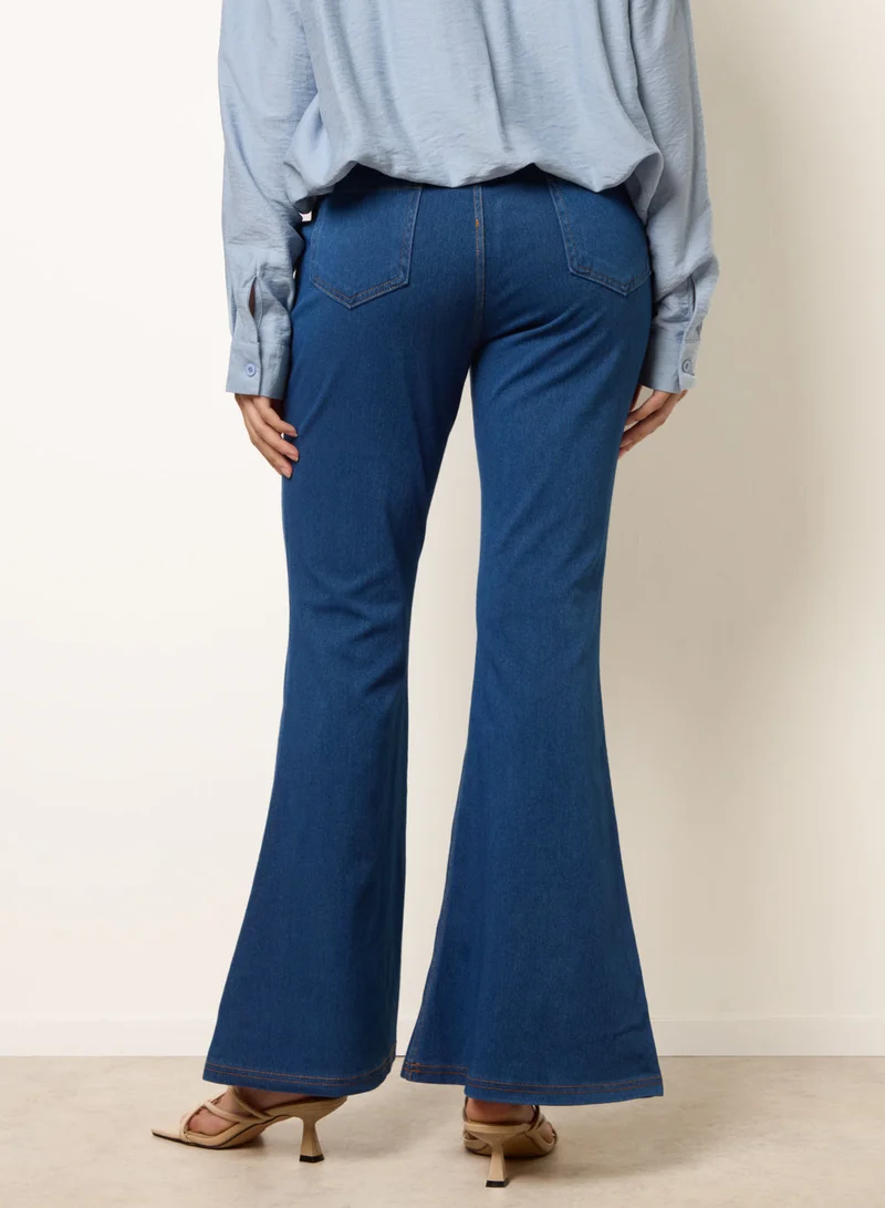 بلو فانيلا Flared Cross Over Waistband Jeans