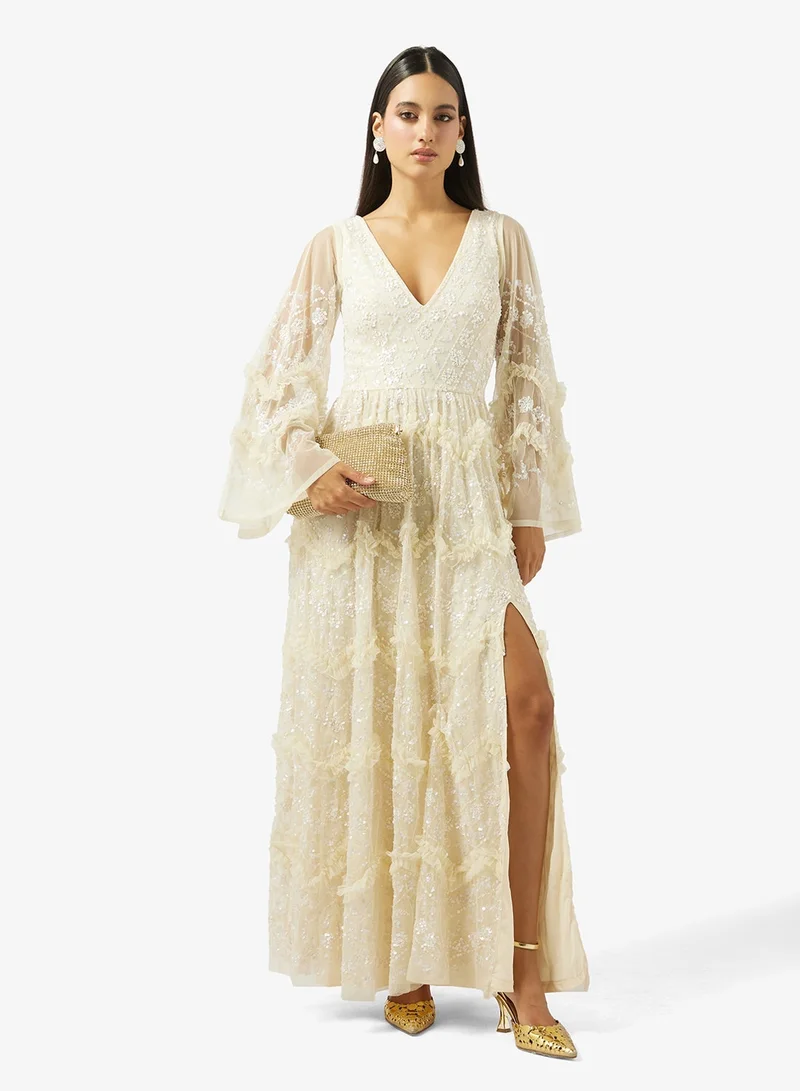 مايا فستان ماكسي طويل الأكمام مزين بكشكشة فاخرة