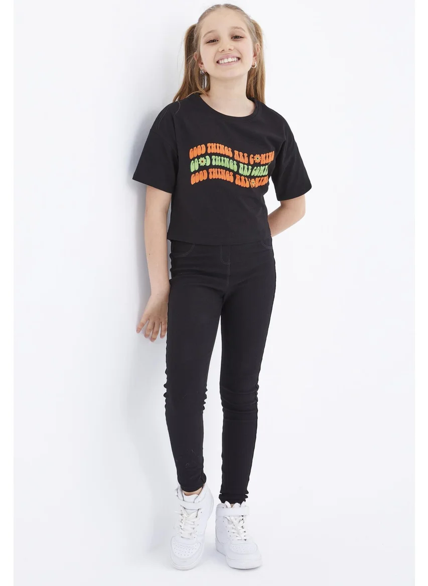 تومي لايف Black Oversize Colorful Text Printed Low Shoulder O Neck Girl Crop T-Shirt - 75038