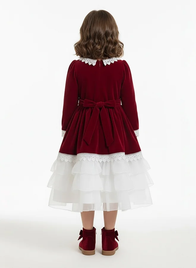 HAWRAA ABAYA Girls’ velvet dress in burgundy with tulle layers and lace – a luxurious design with a back bow belt
