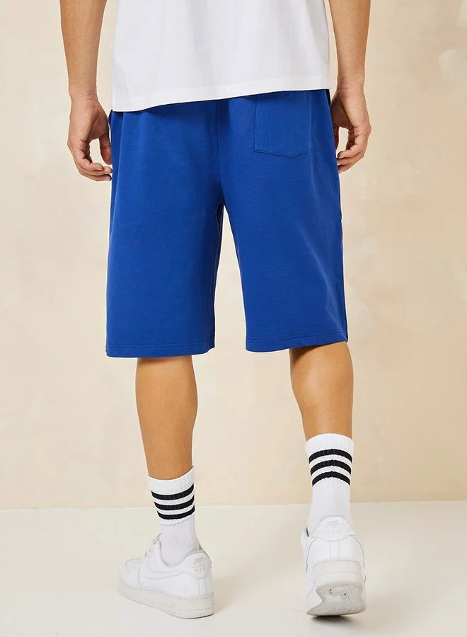 Styli Oversized Terry Shorts with Basketball Print