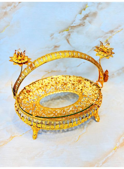 Round serving platter/decorative tray made of gold metal with glass trim.