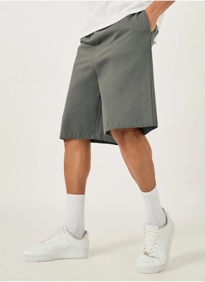 Styli Oversized Solid Shorts with Drawstring