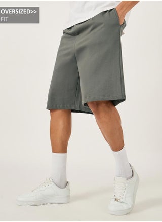 Styli Oversized Solid Shorts with Drawstring - pzsku/Z5DE2A800555251D4C3E7Z/45/1750095774/7d1ce509-2a21-4130-bf53-b6bb7777193a