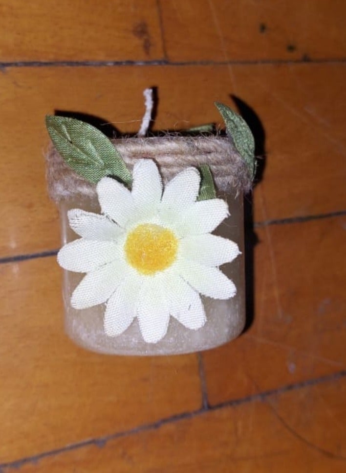 Small candle home decor with daisy flower