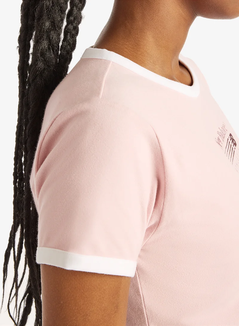 New Balance PINK CHALK (PHK) Trackside Ringer T-Shirt for Women | Best Price UAE