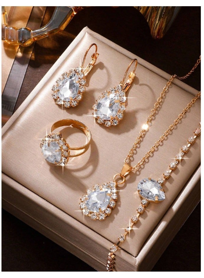 Elegant and distinctive women accessories set consisting of chain with pendant design studded with shiny crystals along with earrings bracelet and ring  - Image 1