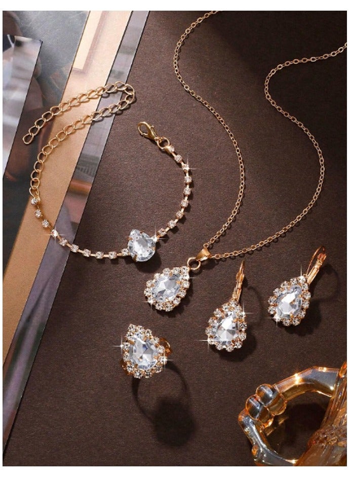 Elegant and distinctive women accessories set consisting of chain with pendant design studded with shiny crystals along with earrings bracelet and ring  - Image 2