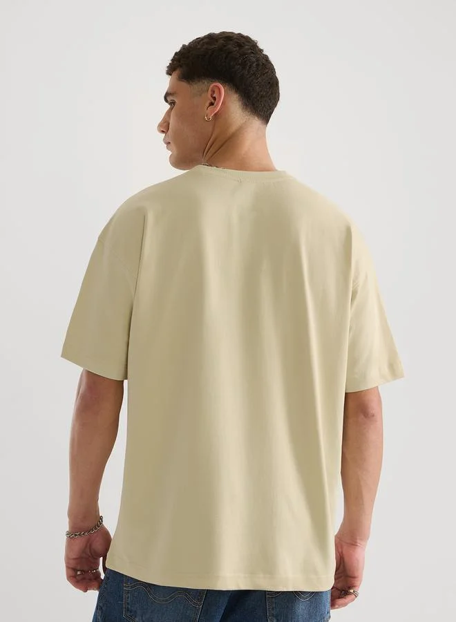 ذا سوليد ستور تيشيرت بقصة واسعة للرجال