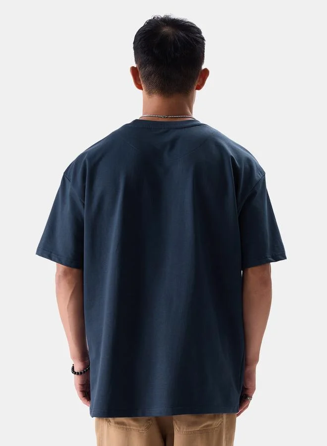 ذا سوليد ستور تيشيرت قطن بقصة واسعة