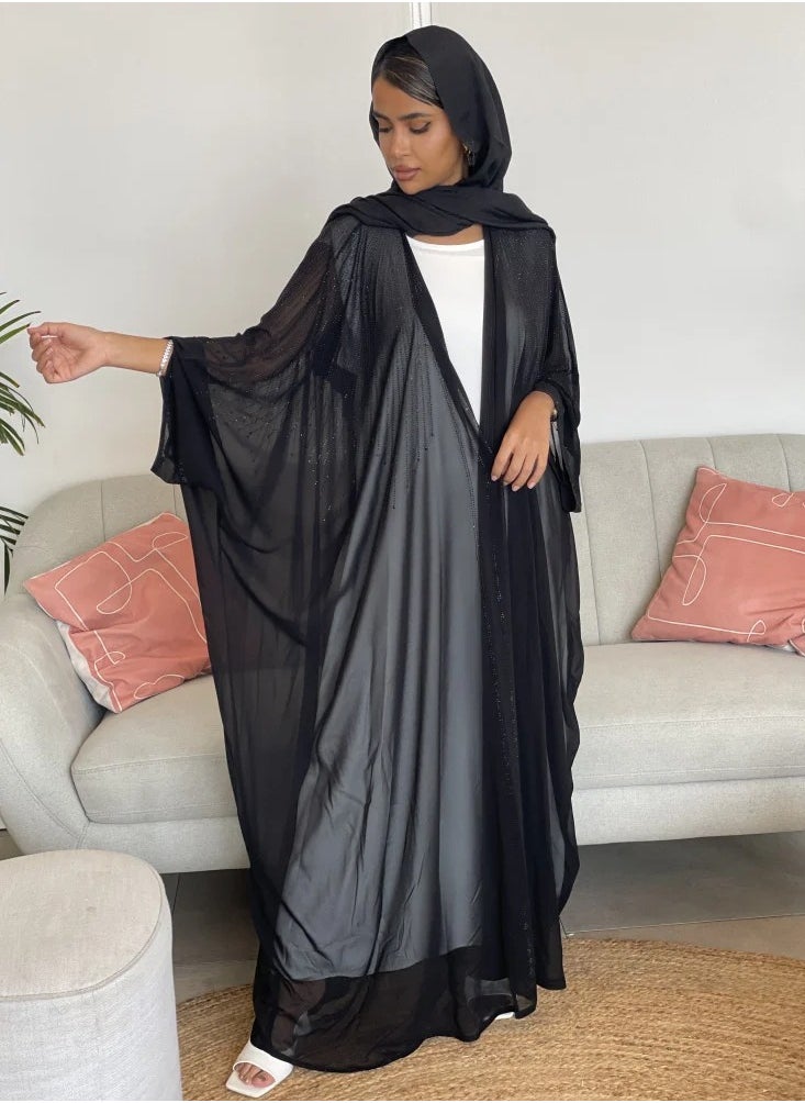 Bisht wrap abaya made of light fabric and decorated with lobes on the front and back in a soft way, adding elegance and elegance, with a plain black veil.