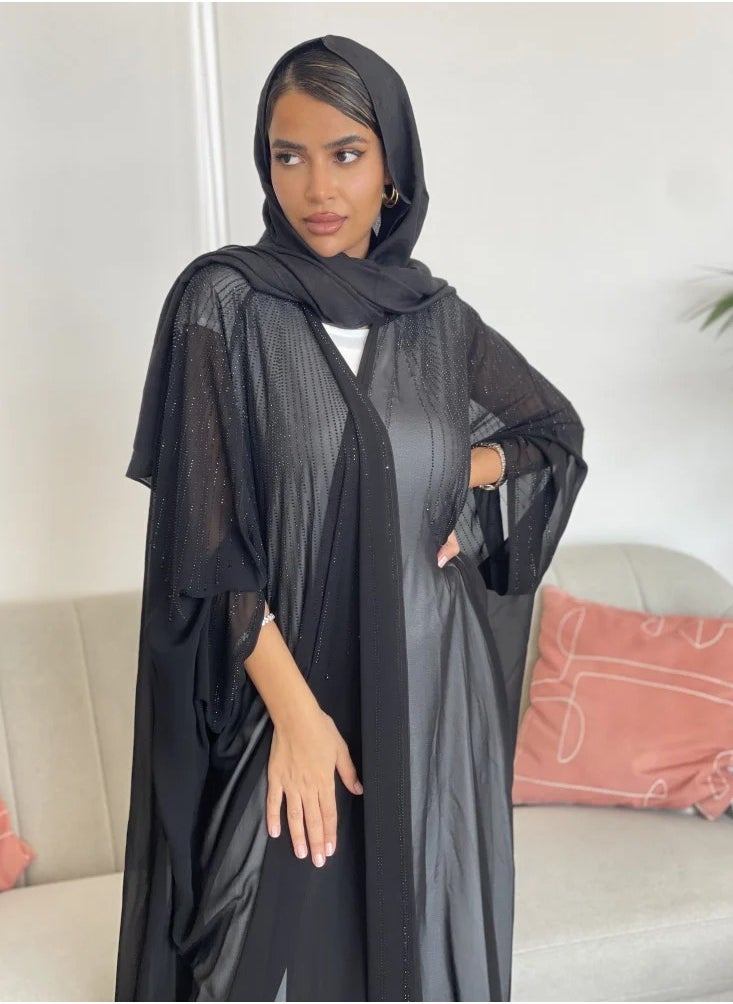 Bisht wrap abaya made of light fabric and decorated with lobes on the front and back in a soft way, adding elegance and elegance, with a plain black veil.