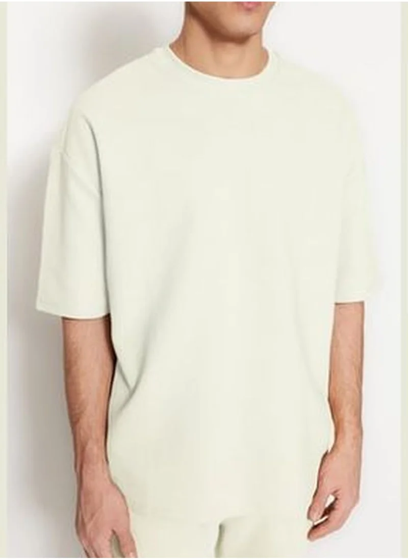 trendyol Limited Edition Ecru Men's Oversize/Wide Cut 100% Cotton Premium Textured T-Shirt.