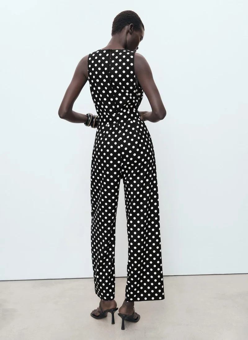 مانجو Linen jumpsuit with polka-dot belt
