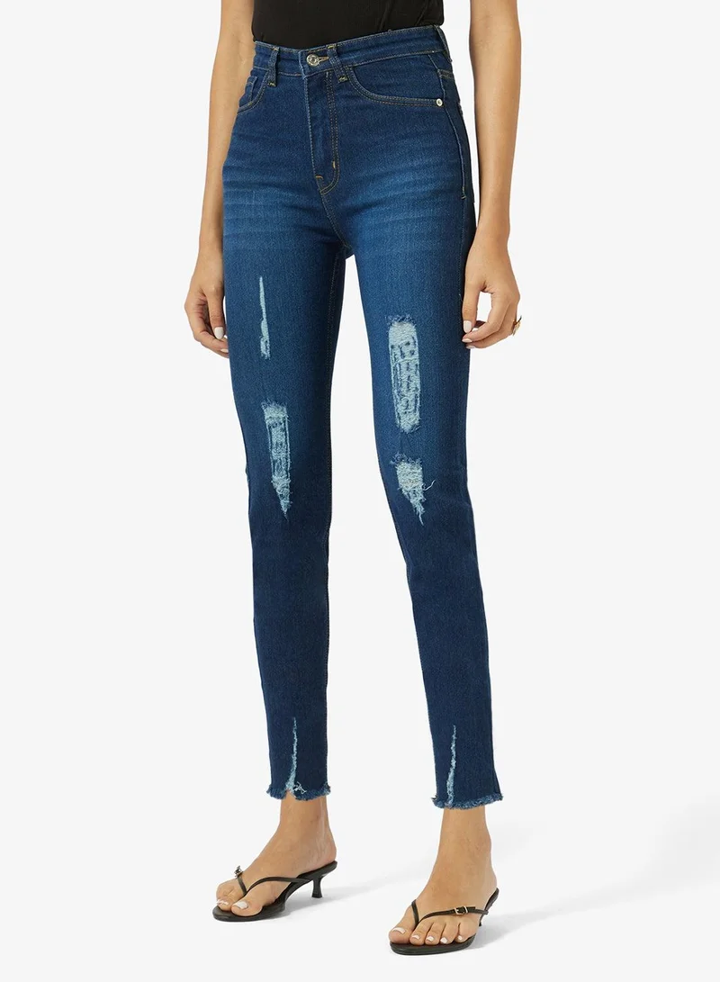 Ripped High Rise Skinny Jeans With Frayed Hem
