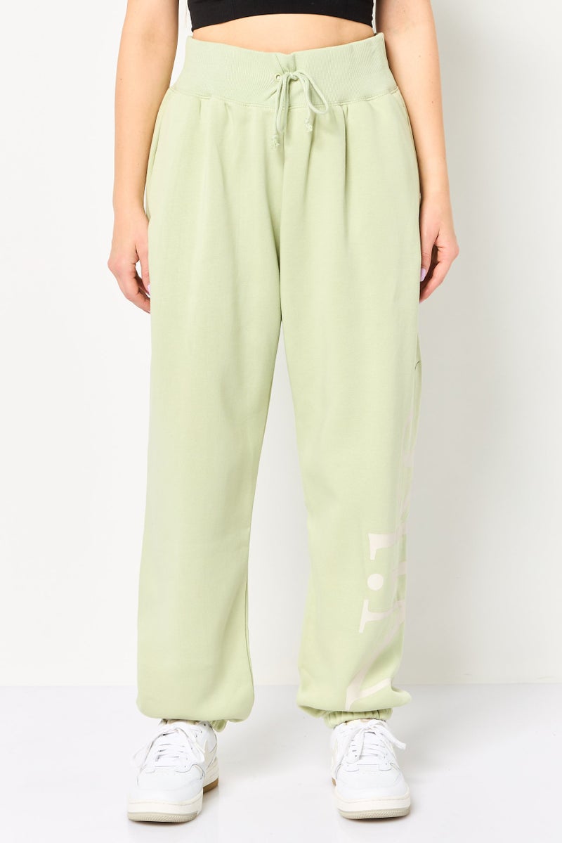 Nike Women Oversized Fit Outdoor Sweatpants, Green - Image 1