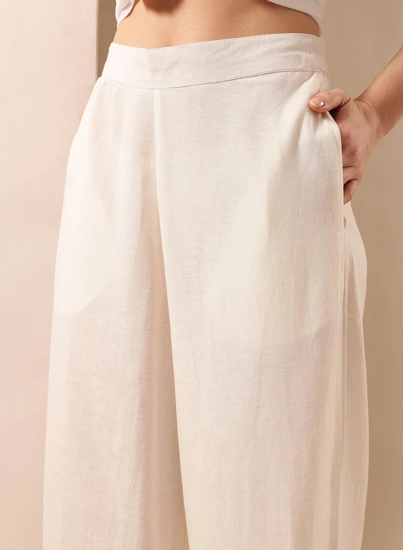 ISHIN  Off White Poly Blend Solid Print Full Length Palazzo Flared Trouser For Women for Women | Best Price UAE