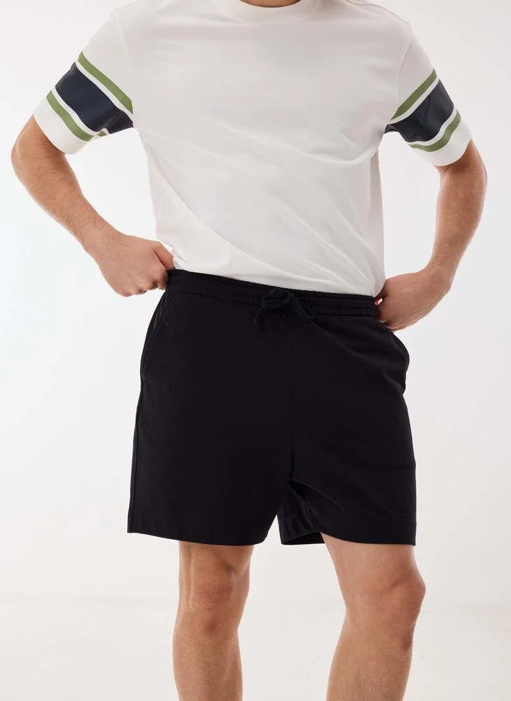 Ashita Fernandes  Solid Drawstring Waist Shorts for Men | Best Price UAE