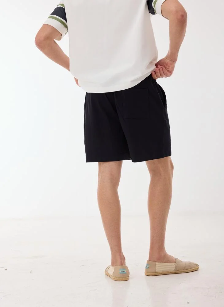 Ashita Fernandes  Solid Drawstring Waist Shorts for Men | Best Price UAE