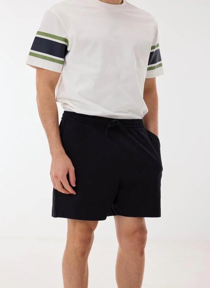 Ashita Fernandes  Solid Drawstring Waist Shorts for Men | Best Price UAE