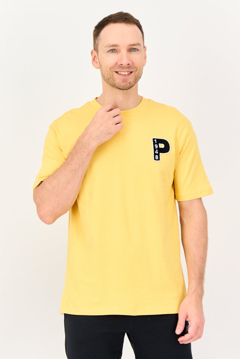 PUMA Men Sportswear Fit Short Sleeve Outdoor T Shirt, Yellow - Image 1