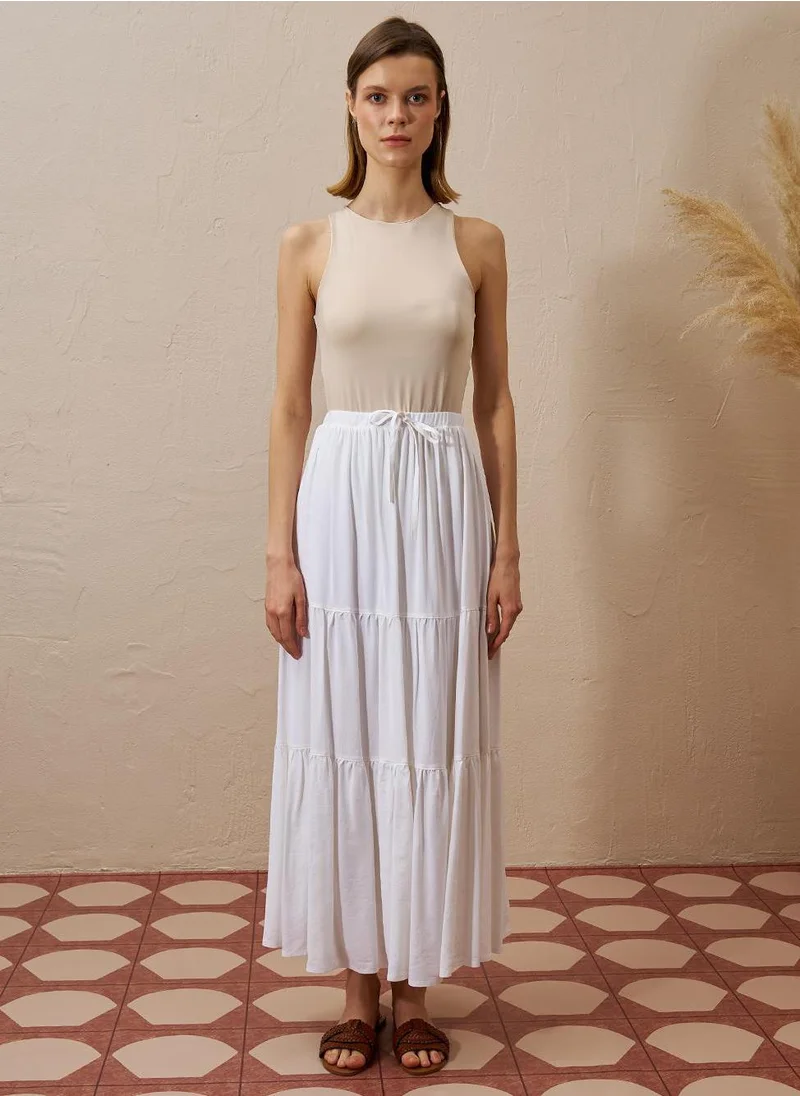 Kayra Layered Hem High-Waist Skirt in Ecru