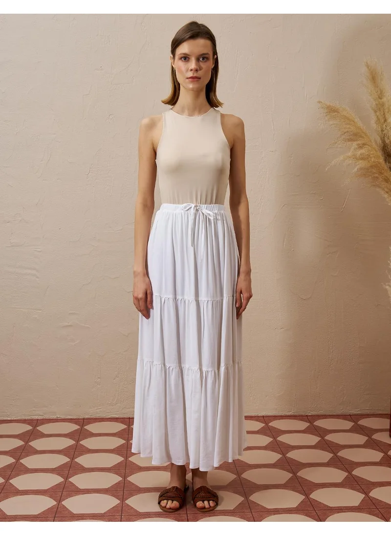 Kayra Layered Hem High-Waist Skirt in Ecru