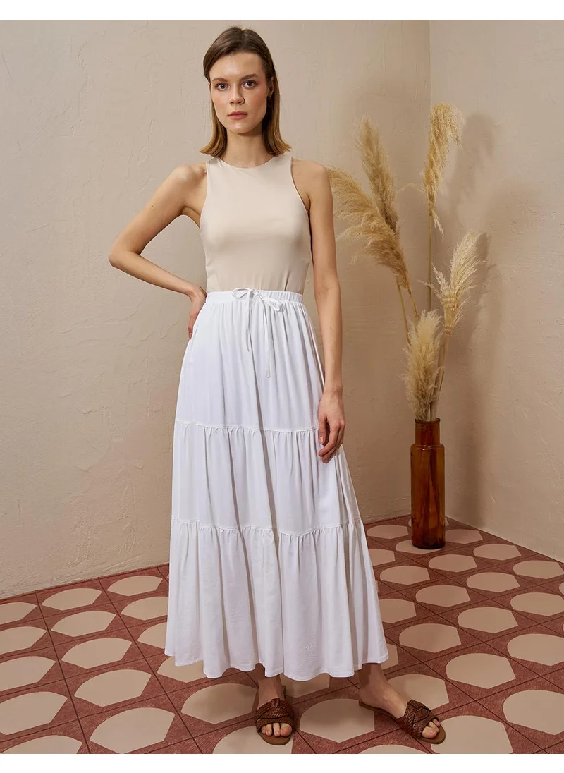 Kayra Layered Hem High-Waist Skirt in Ecru