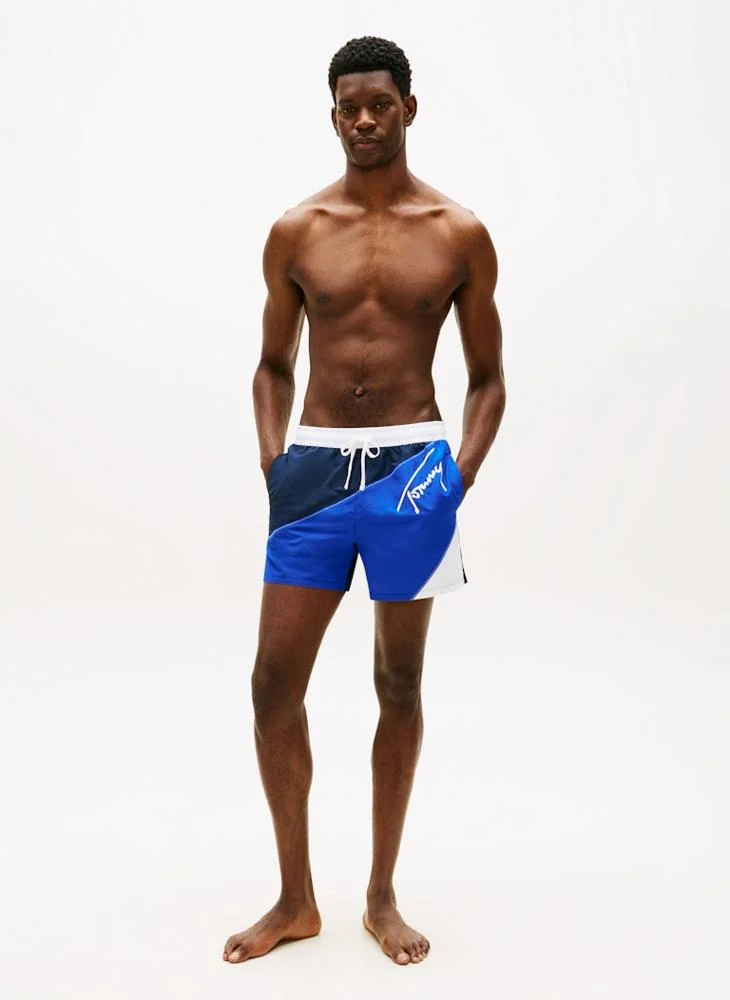 TOMMY HILFIGER  Signature Colour-Blocked Mid Length Swim Shorts for Men | Best Price UAE