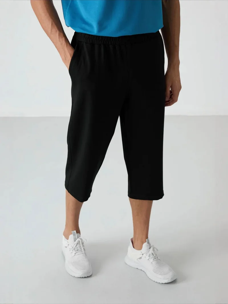 Tommylife Black TOMMY Men's Jersey Capri Shorts for Men | Best Price UAE