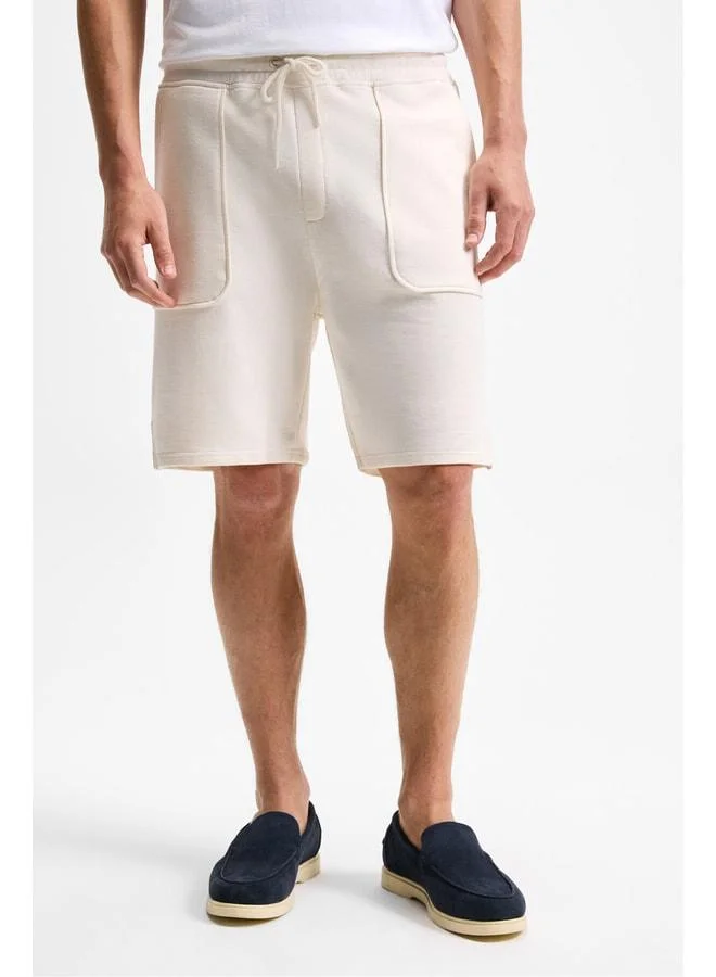 GRIMELANGE GAUCI Men's Elastic Waist Side and Back Pocket Relaxed Beige Shorts.