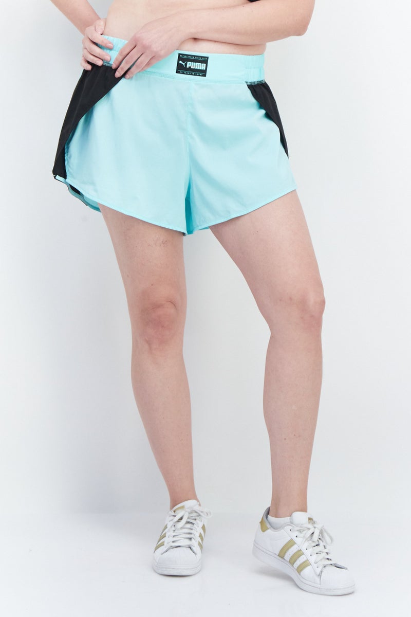 PUMA Women Sportswear Fit Brand Logo Training Shorts, Green - Image 1