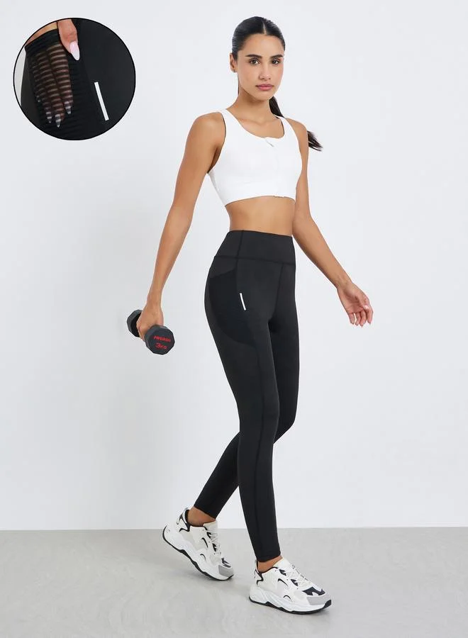 Styli Active Women Textured Pocket Reflective Stripe 7/8 Leggings