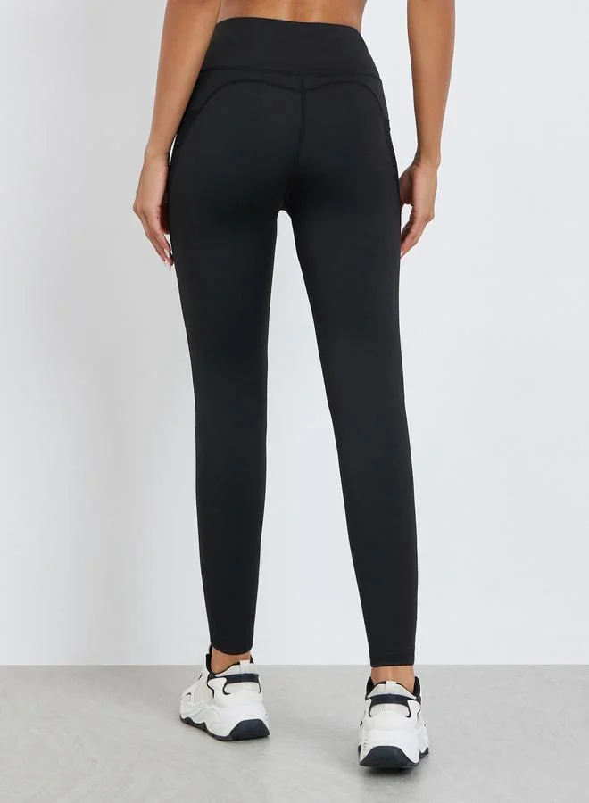 Styli Active  Women Textured Pocket Reflective Stripe 7/8 Leggings for Women | Best Price UAE