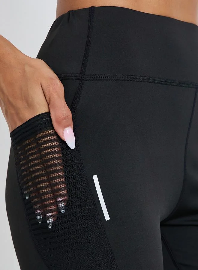 Styli Active  Women Textured Pocket Reflective Stripe 7/8 Leggings for Women | Best Price UAE