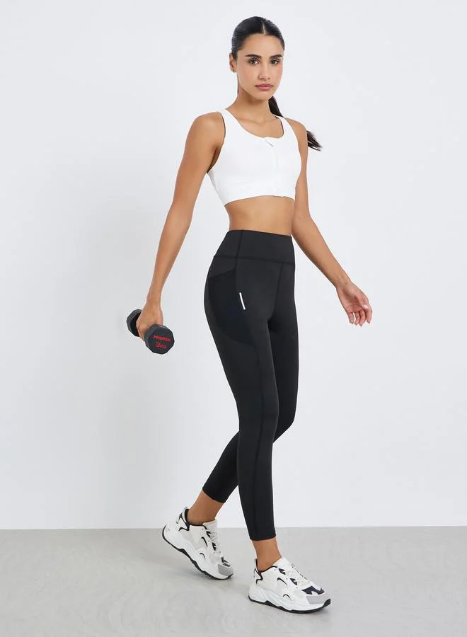 Styli Active  Women Textured Pocket Reflective Stripe 7/8 Leggings for Women | Best Price UAE