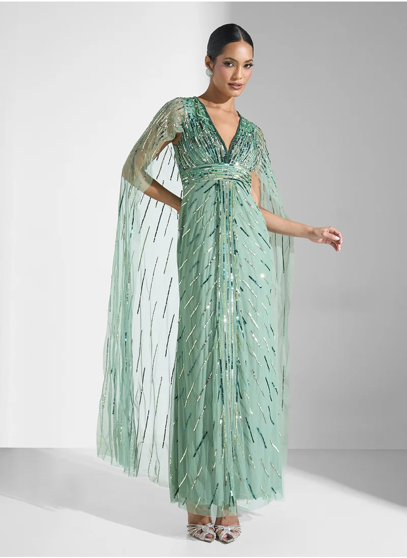 Namshi x Embellished Evening Dress With Cape
