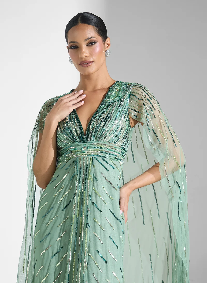 Namshi x Embellished Evening Dress With Cape