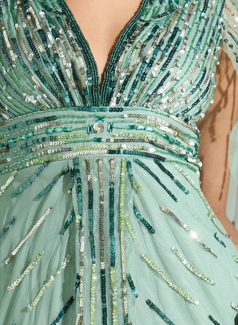 Namshi x Embellished Evening Dress With Cape