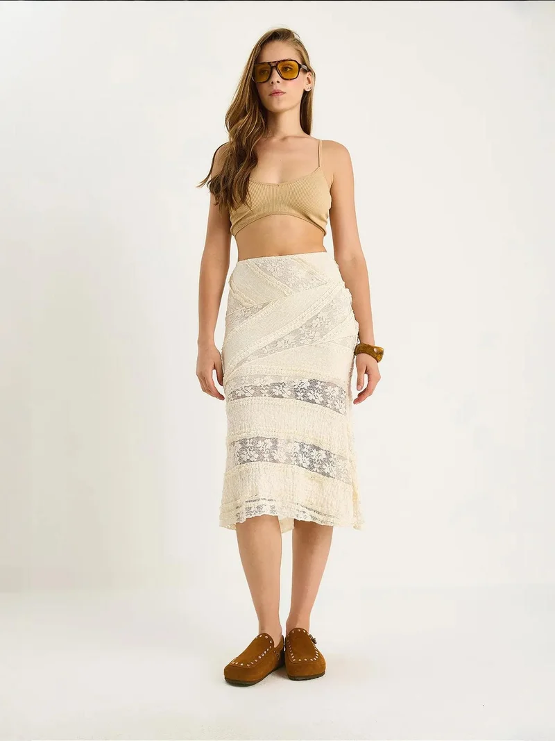 بيانكو لوتشي تنورة ميدي بخصر عالٍ ولوحات جانبية من لوتشي