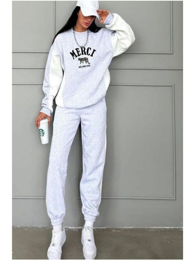 MANIKAN MANIKAN- Gray sports set with white accents, featuring a modern and stylish design perfect  - Image 1