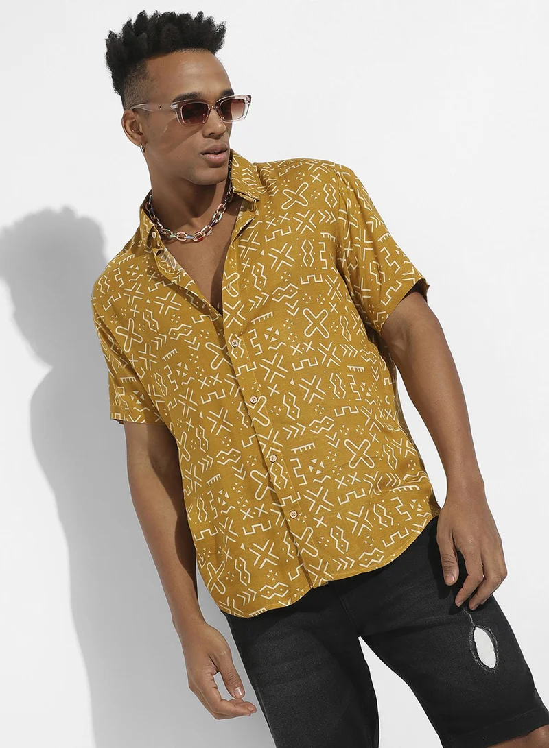 كامبوس سوترا Campus Sutra Men's Mustard Yellow Minimal Aztec Shirt For Casual Wear | Spread Collar | Short Sleeve | Button Closure | Heavy Rayon Shirt Crafted With Comfort Fit For Everyday Wear
