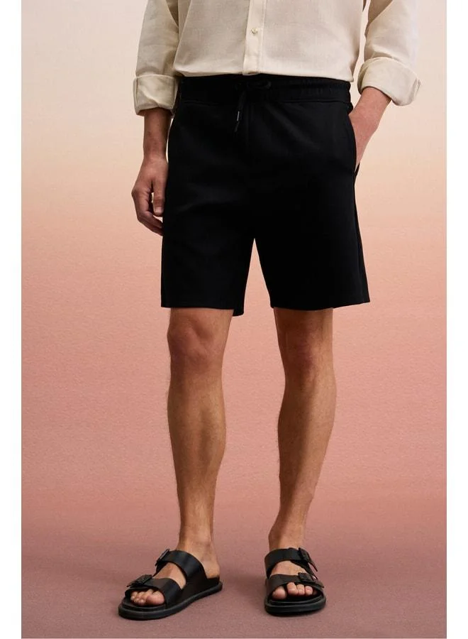 GRIMELANGE TYRONE Men's Elastic Waist Single Back Pocket Relaxed Fit Black Shorts.
