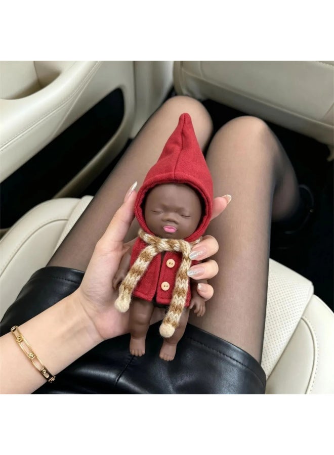 The 14cm Natasha doll, a popular internet sensation, is a stress-relieving toy and a great way to prank office workers and alleviate anxiety. It even comes with clothes! - Image 4
